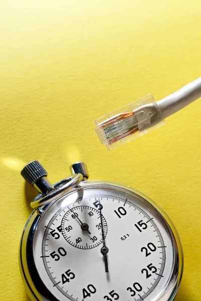 Ethernet cable and stopwatch — Stock Photo, Image