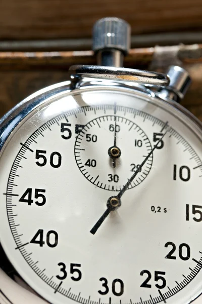 Pile of old books and stopwatch — Stock Photo, Image