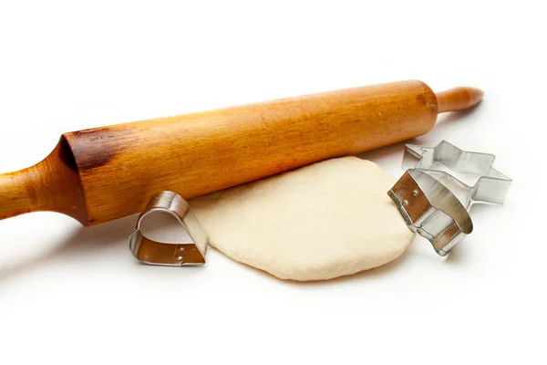 Rolling pin with dough and cookie forms — Stock Photo, Image