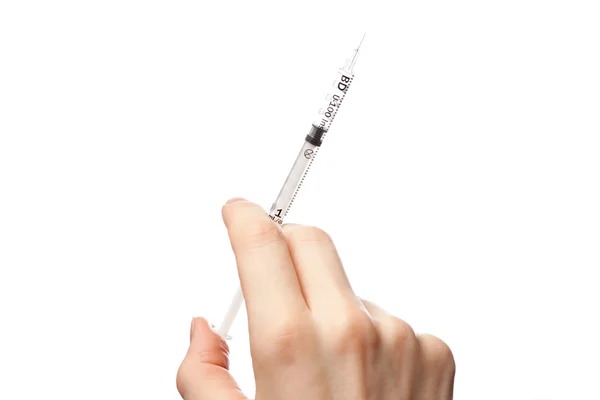 Female hand with syringe — Zdjęcie stockowe
