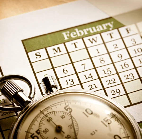 Kalender bulanan dan stopwatch — Stok Foto