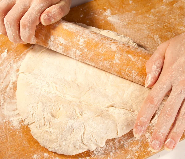 Rolling the dough with hands — Stock Photo, Image