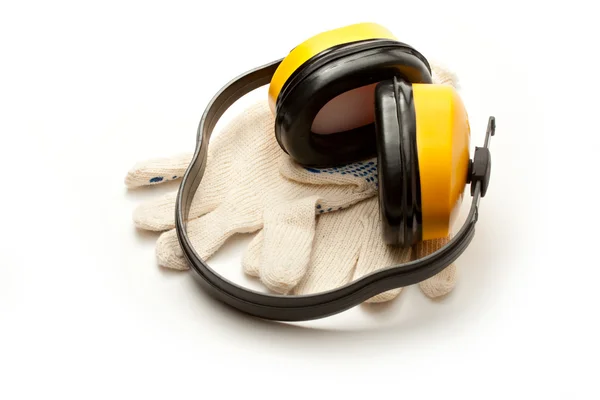 Headphones and pair of working gloves — Stock Photo, Image
