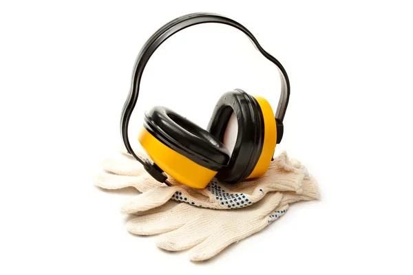 Headphones and pair of working gloves — Stock Photo, Image