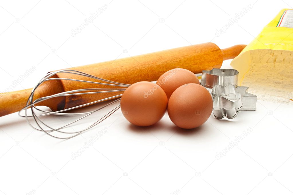 Eggbeater, eggs, flour and cookies forms