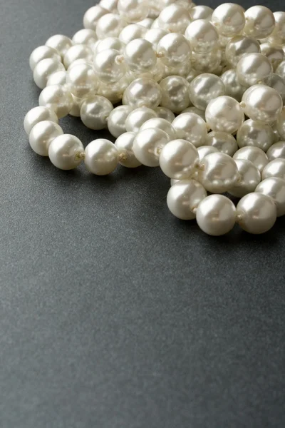 Perle isoliert auf grau — Stockfoto