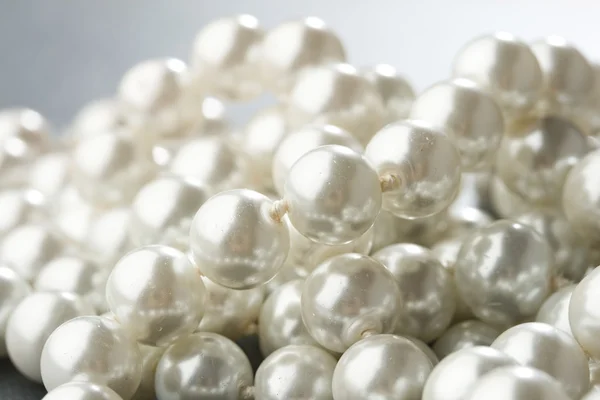 Pearl isolated on grey — Stock Photo, Image