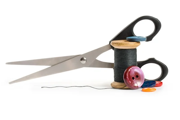 Thread bobbin, scissors and buttons — Stock Photo, Image