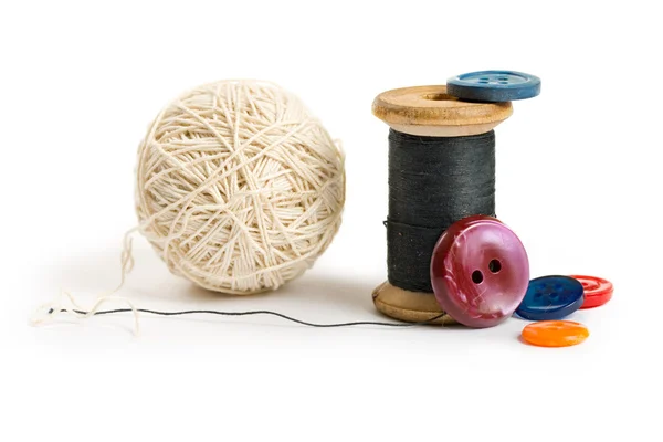 Thread bobbin and buttons — Stock Photo, Image