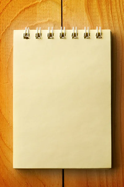 Notepad on wooden background — Stock Photo, Image