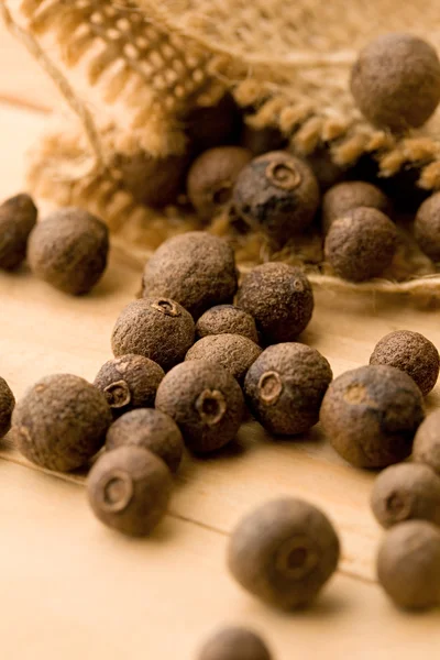 stock image Pepper isolated on wooden background