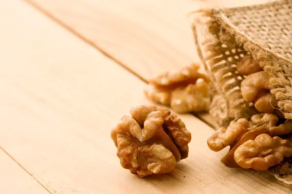 stock image Walnut isolated on wooden background