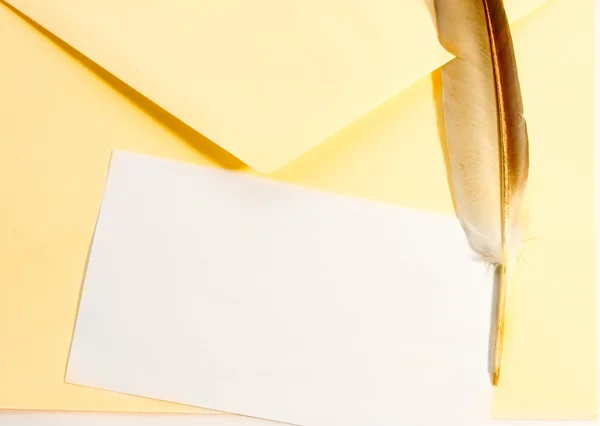 Envelope and feather — Stock Photo, Image