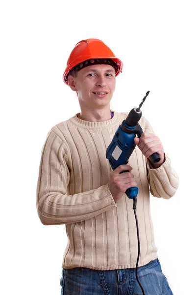 Trabalhador em capacete vermelho com broca — Fotografia de Stock