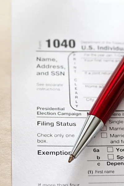 Tax form and a red pen — Stock Photo, Image