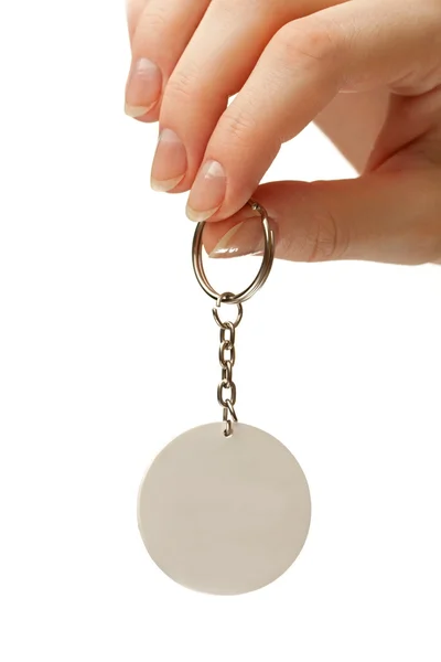 Female hand with blank badge — Stock Photo, Image