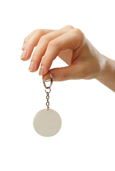 Female hand with blank badge — Stock Photo, Image