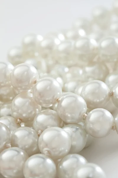 String of pearls on white — Stock Photo, Image