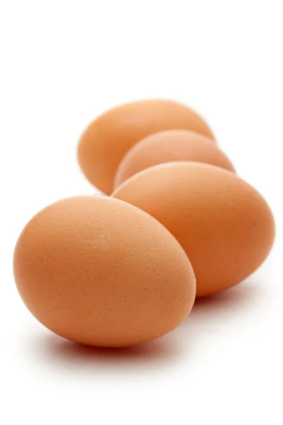 Яйця на білому тлі — стокове фото
