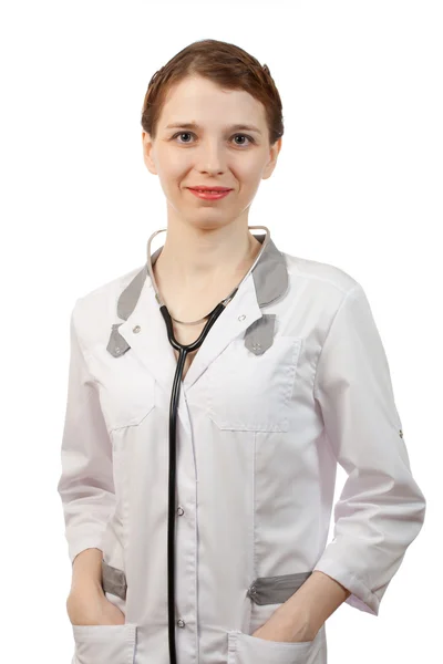 Kvinna läkare står med stetoskop — Stockfoto