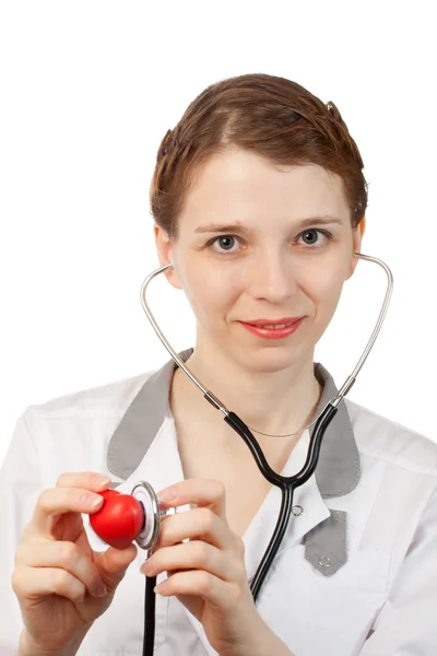 Woman doctor with stethoscope and heart — Stock Photo, Image