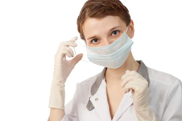 Nurse putting on medical mask — Stock Photo, Image