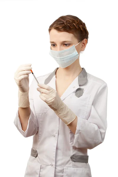 Infermiera in guanti sterili e maschera medica — Foto Stock