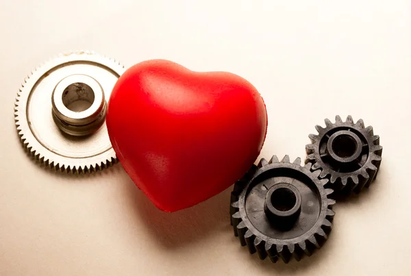 Mechanical ratchets and red heart — Stock Photo, Image
