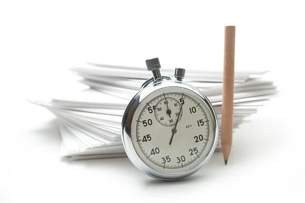Pile of paper cards with pencil and stopwatch — Stock Photo, Image