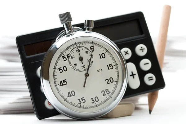 Pile of paper cards, calculator and stopwatch — Stock Photo, Image
