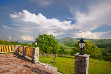 Enclosed terrace with mountain views clipart