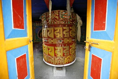 Colourful buddist praying wheels clipart