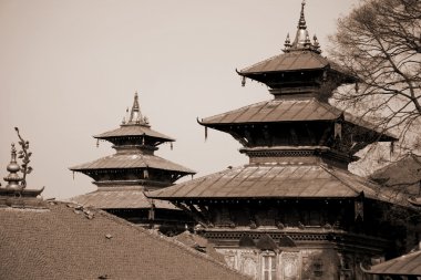 Two pagodas towers in durbar square in sepia, kathmandu, nepal clipart