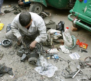 Mechanic at workshop in delhi, india clipart