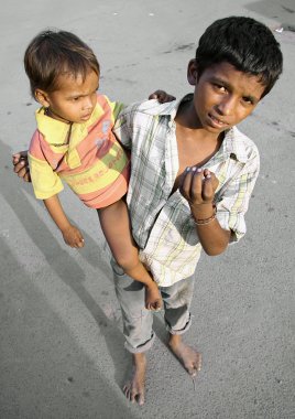 Child beggar on the street, delhi, india clipart