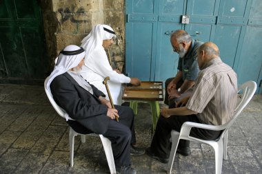 Old arab men playing backgammon, old city, jerusalem, israel clipart