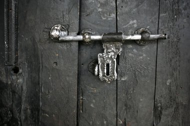 Latch on door of monastery in muktinath, nepal clipart