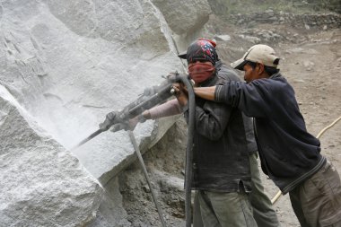 Road construction workers preparing for dynamiting, annapurna, nepal clipart