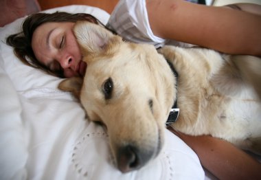 Woman and dog and bed clipart