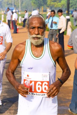 Elderly male sikh marathon runner clipart