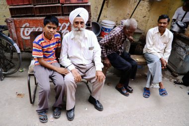 Sikh man and grandson clipart