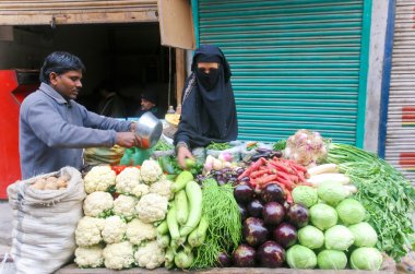 Woman buying vegetables clipart