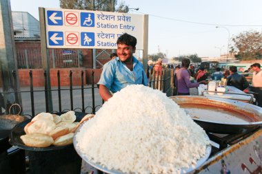 Man at street stall clipart