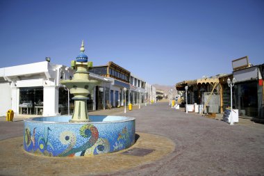 Mosaic fountain on central market street in dahab, red sea, sinai, egypt clipart