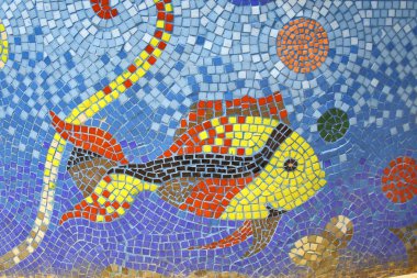 Fish mosaic art on fountain pond in dahab, sinai, egypt clipart