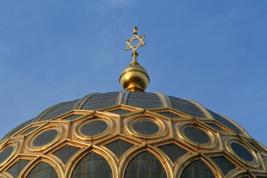 Star of david on top of a synagogue in berlin, germany clipart