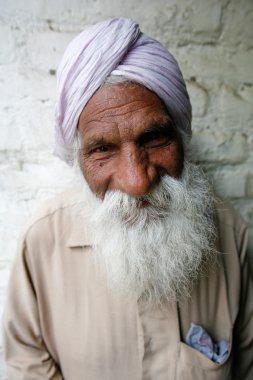 Old Hindu with long white beard clipart