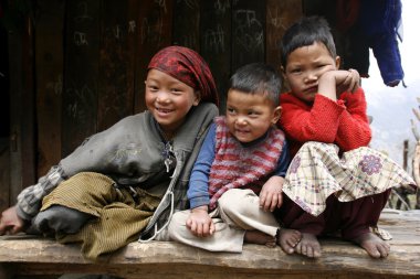 Three young kids on the annapurna circuit, nepal clipart