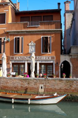 Restaurant and gondola, Venice, Italy clipart