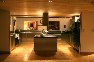 Modern kitchen at night clipart